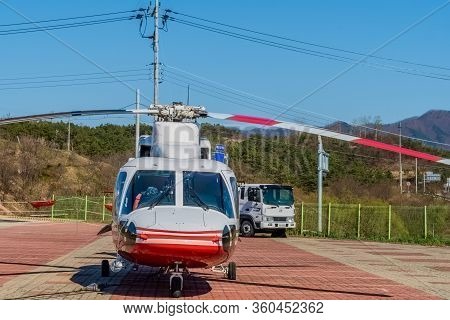 Hwanggan, South Korea; April 8, 2020: Front View Of Sikorsky S76c+ Helicopter Parked On Helipad Unde
