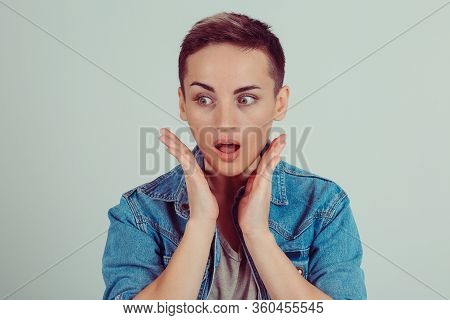Closeup Portrait, Headshot Startled Woman, Looking Side Wards Side Shocked Surprised Hands On Cheeks