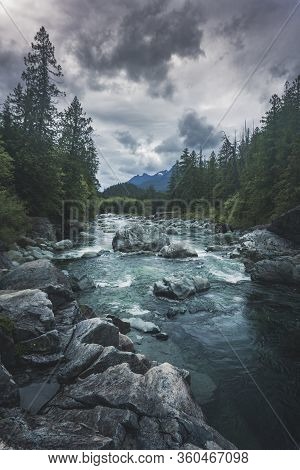 The Beauty Of Wally Creek Pullout. Forest, Wild River, Rocks And Trees On Vancouver Island In Canada