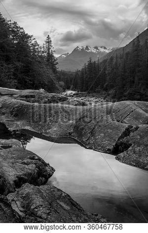The Beauty Of Wally Creek Pullout. Forest, Wild River, Rocks And Trees On Vancouver Island In Canada