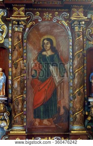 LAZ, CROATIA - JULY 14, 2014: St. John the Evangelist altarpiece at St. Andrew's Church in Laz, Croatia