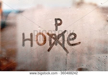 Foggy Glass On Window With Written Finger Word Home, M Is Crossed Out And Corrected By P Concept Pho