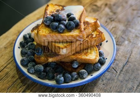 Toasted Bread With Bluberries - French Toast With Berries Blueberries, Strawberries And Sauce, Tradi