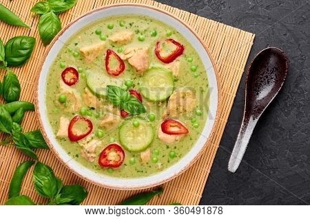 Thai Green Curry With Chicken Or Gaeng Kaew Wan Gai In White Bowl At Black Slate Background. Thai Gr