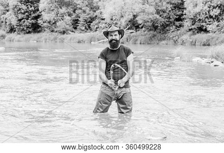 Pro Fishing. Bearded Fisher In Water. Hobby And Sport Activity. Pothunter. Fisherman With Fishing Ro
