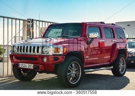Marbella, Spain - December 2018: Red Suv Car Hummer H3 Is Staying Parked Near Entrance To City Yacht