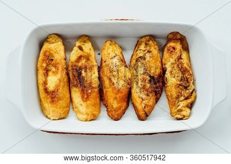 Torrijas, Typical Spanish Sweet Fried Toasts Of Sliced Bread Soaked In Eggs And Milk On Tray Isolate