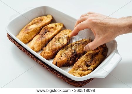 Male Hand Taking Torrijas, Typical Spanish Sweet Fried Toasts Of Sliced Bread Soaked In Eggs And Mil
