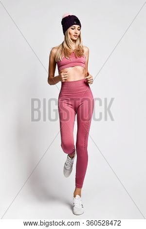Beautiful Sexy Blonde Woman With Perfect Athletic Slim Figure By Physical Education Or Fitness, Lead