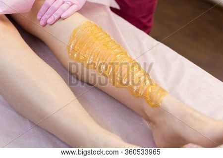 Sugar Depilation Of The Feet In The Beauty Salon. Rid Of Hair On The Legs. Sugaring. Master Shugarin