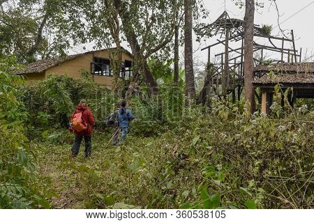 Tourists On A Safari Walk At Chitwan National Park On Nepal