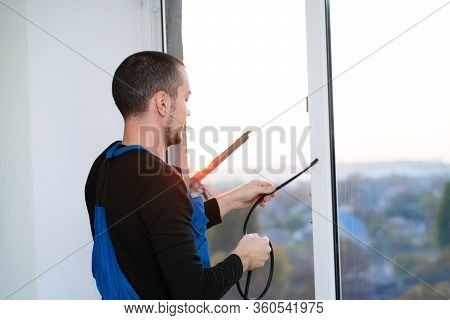 Professional Master At Repair And Installation Of Windows, Changes Rubber Seal Gasket In Pvc Windows