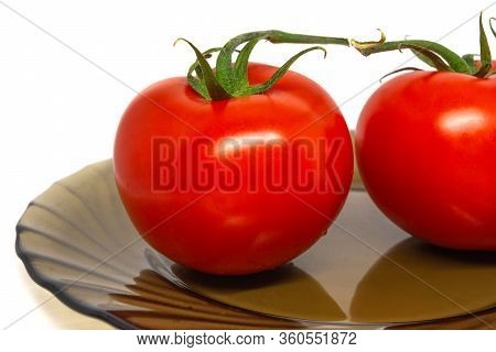 Two Bright Tomato On Slass Plate Whithout Shadow