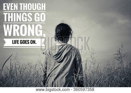 Inspirational Quote - Even Though Things Go Wrong, Life Goes On. With Young Woman In The Meadow In V