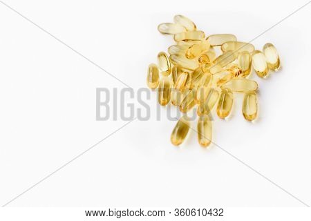 Many Softgel Or Gelcap Transparent Capsule Pills With Omega 3 And Vitamins C And D As Medicine To Bo