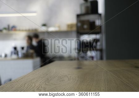 Cafe Background. It Is Visible Part Of A Wooden Table. Blurred Background. Suitable For Layout. Styl