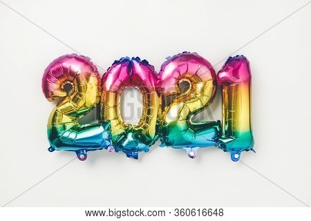 Rainbow colored Foil balloons in the form of numbers 2021. New year celebration
