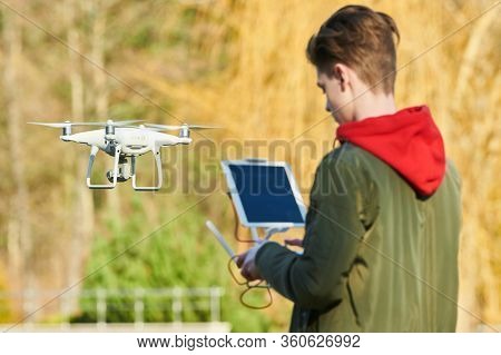 drone flying. copter pilotage at river sunset