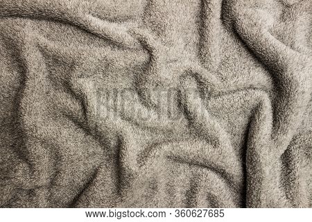 Gray Crumpled Bedspread Texture For Background With Black Vignette. Close-up Of Natural Warm Wool Co