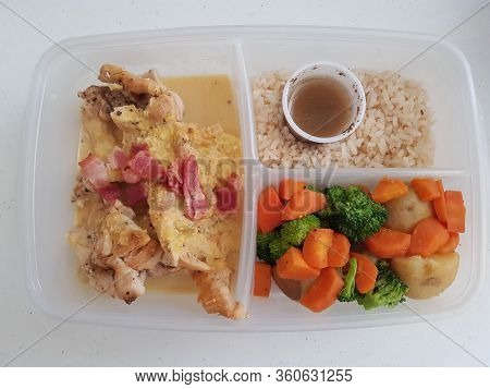 A Picture Chicken In Coconut Sauce With Rice And Salad With Vinaigrette