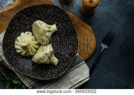 Traditional Georgian Khinkali Dish On Stone Background