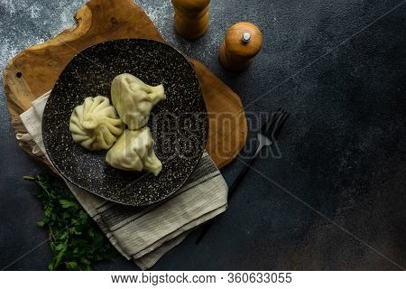 Traditional Georgian Khinkali Dish On Stone Background