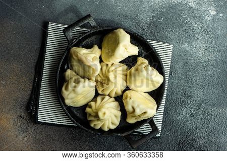 Traditional Georgian Khinkali Dish On Stone Background