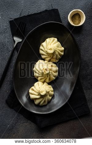 Traditional Georgian Khinkali Dish On Stone Background