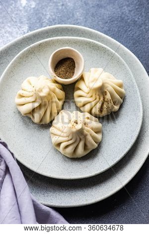 Traditional Georgian Khinkali Dish On Stone Background