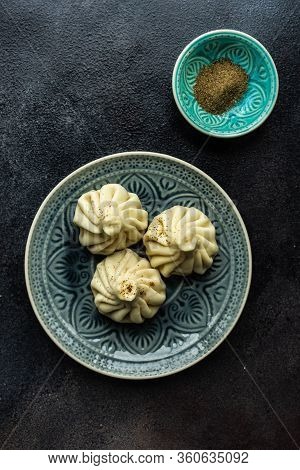 Traditional Georgian Khinkali Dish On Stone Background