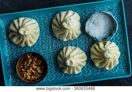 Traditional Georgian Khinkali Dish On Stone Background