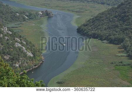 Rijeka Crnojevića, Part Of The Skadar Lake In Montenegro. Tourist Cruises By Boat On The Beautiful M