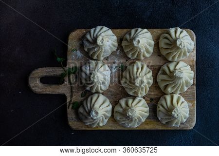 Traditional Georgian Khinkali Dish On Stone Background