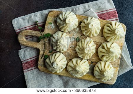 Traditional Georgian Khinkali Dish On Stone Background