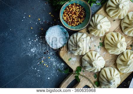 Traditional Georgian Khinkali Dish On Stone Background
