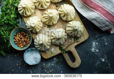 Traditional Georgian Khinkali Dish On Stone Background