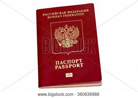 Red Biometric Passport Of A Russian Citizen Isolated On White Background, Close-up. Inscription - Ru
