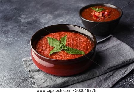 Two Bowls With Different Types Of Homemade Gazpacho. Traditional Tomato Cool Soup With Basil On And 