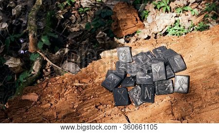 24 Norse Runes Stones On Old Wood Background. Wallpaper.