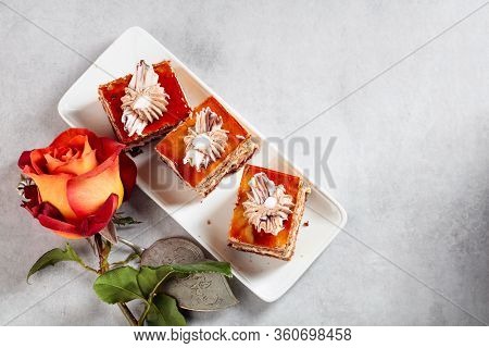 Layered Cakes With Rose On A White Marmorean Table. Romantic Breakfast.