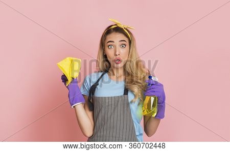 Amazed Housewife Holding Spray And Sponge In Her Hands, Free Space