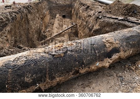 repair and replacement main pipeline of heating systems, district heating pipes network, water supply or Sewerage in city, removing old pipes and replacing them with new ones in a hole in the ground