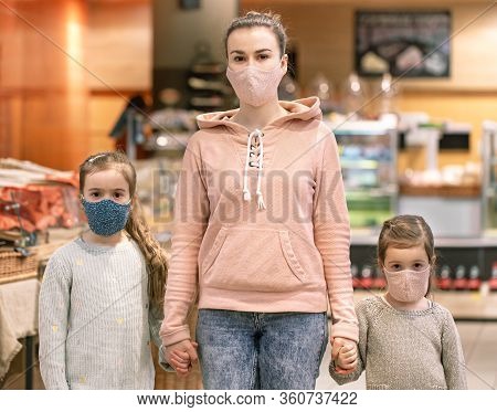 Mom And Kids Are Shopping At The Grocery Store.