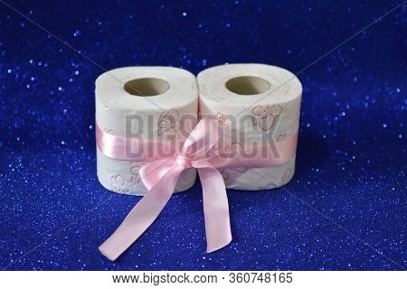 Rolls Of Toilet Paper On Glitter Blue Background