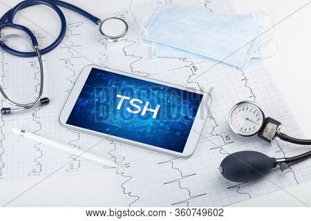 Close-up view of a tablet pc with TSH abbreviation, medical concept
