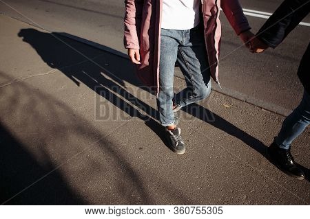 Young Couple In Love Walking In The Park.