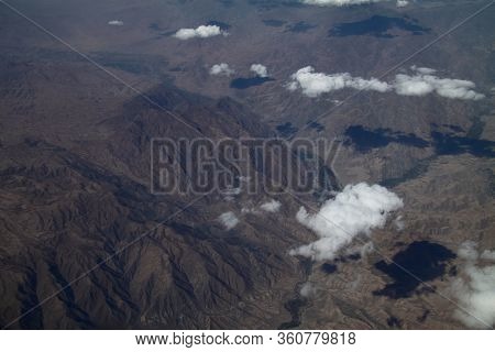 Mountains And Sky Landscape. Beauty Atmosphere. View From The Airplane. Arial View At The Earth. Hig
