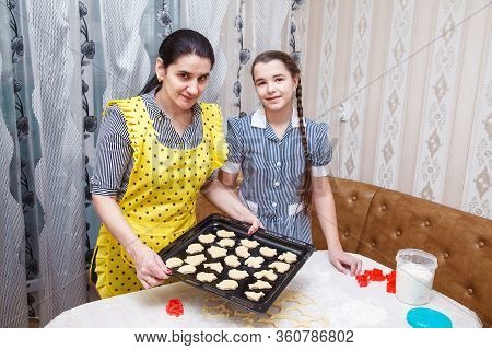 Mom And Daughter Bake Homemade Cookies In The Citchen. Coronavirus Quarantine
