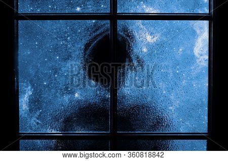 Dark Silhouette Of Child Alone In Isolation Behind Glass Door. Abstract Image Of Sadness, Apathy, De