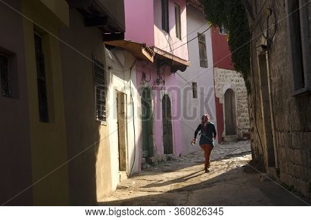 Antakya, Turkey. December 22rd 2013 
Young Local Girl Runs Through The Narrow Alleyways Of The Old P